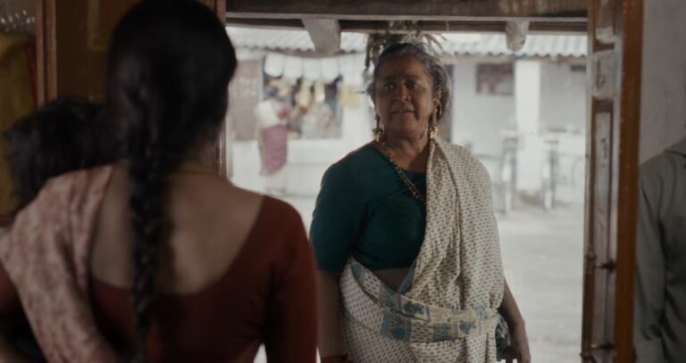 Radhika threatens her as an old woman in Thaai Kelavi Movie