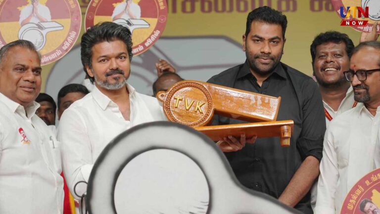 Fan throws pori urundai to Vijay during roadshow