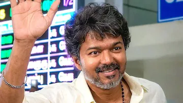 Elderly woman meditates outside actor Vijay house