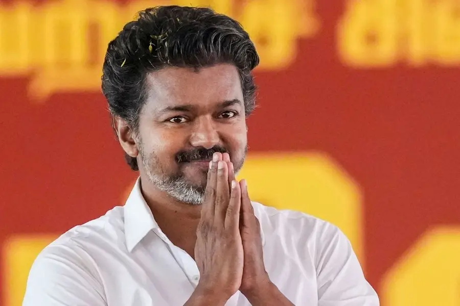 Elderly woman meditates outside actor Vijay house